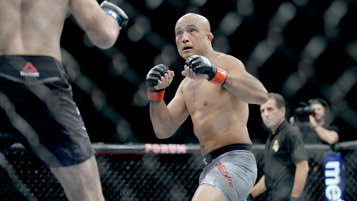 BJ Penn (red gloves) fights Ryan Hall (blue gloves) during UFC 232 at The Forum.