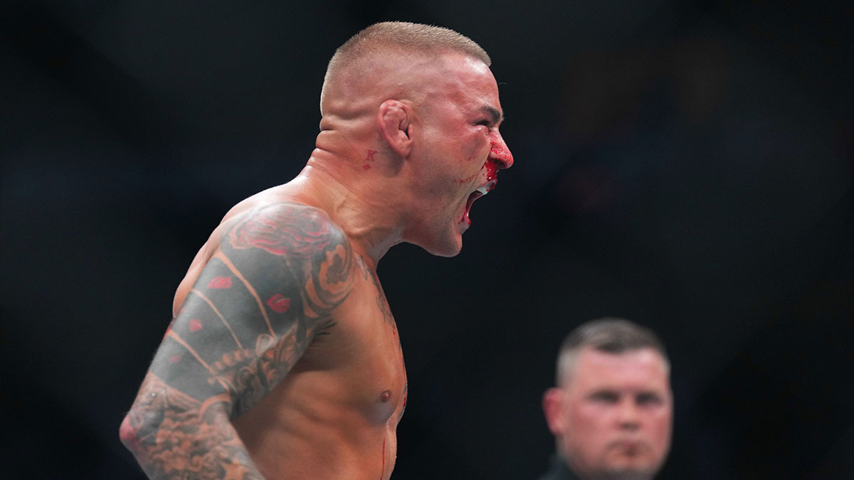 Dustin Poirier (blue gloves) reacts during the fight against Islam Makhachev (red gloves) during UFC 302 at Prudential Center.