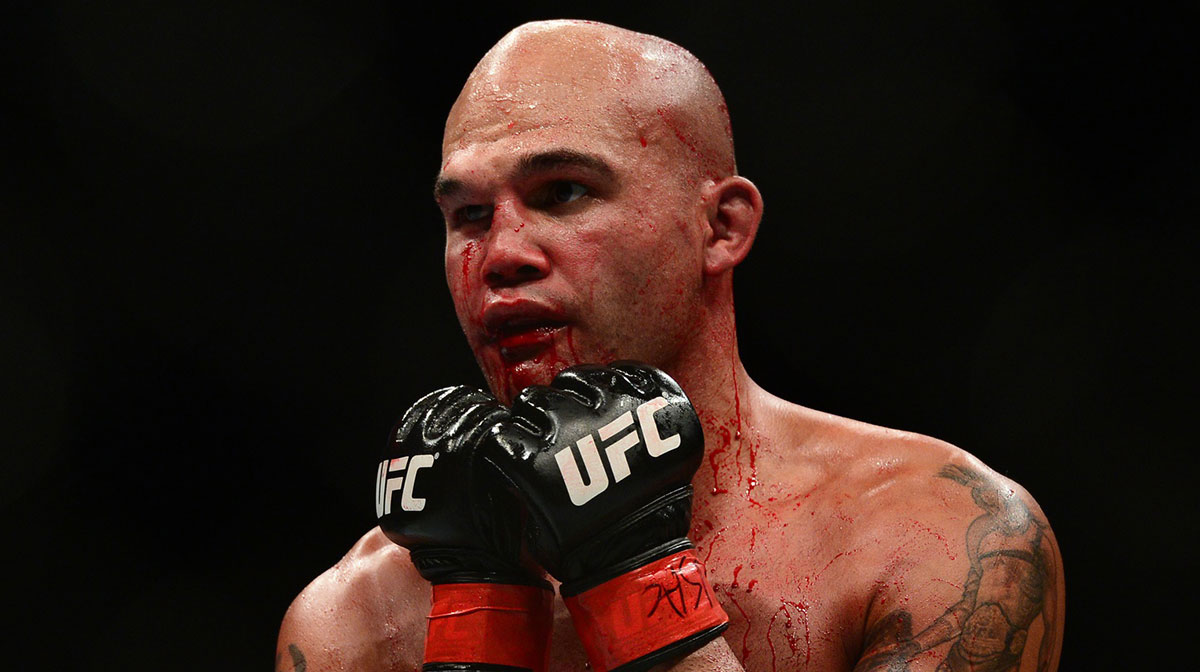 Robbie Lawler (red gloves) and Rory MacDonald (blue gloves) fight during their welterweight title bout during UFC 189 at MGM Grand Garden Arena. Lawler won via fifth round TKO.