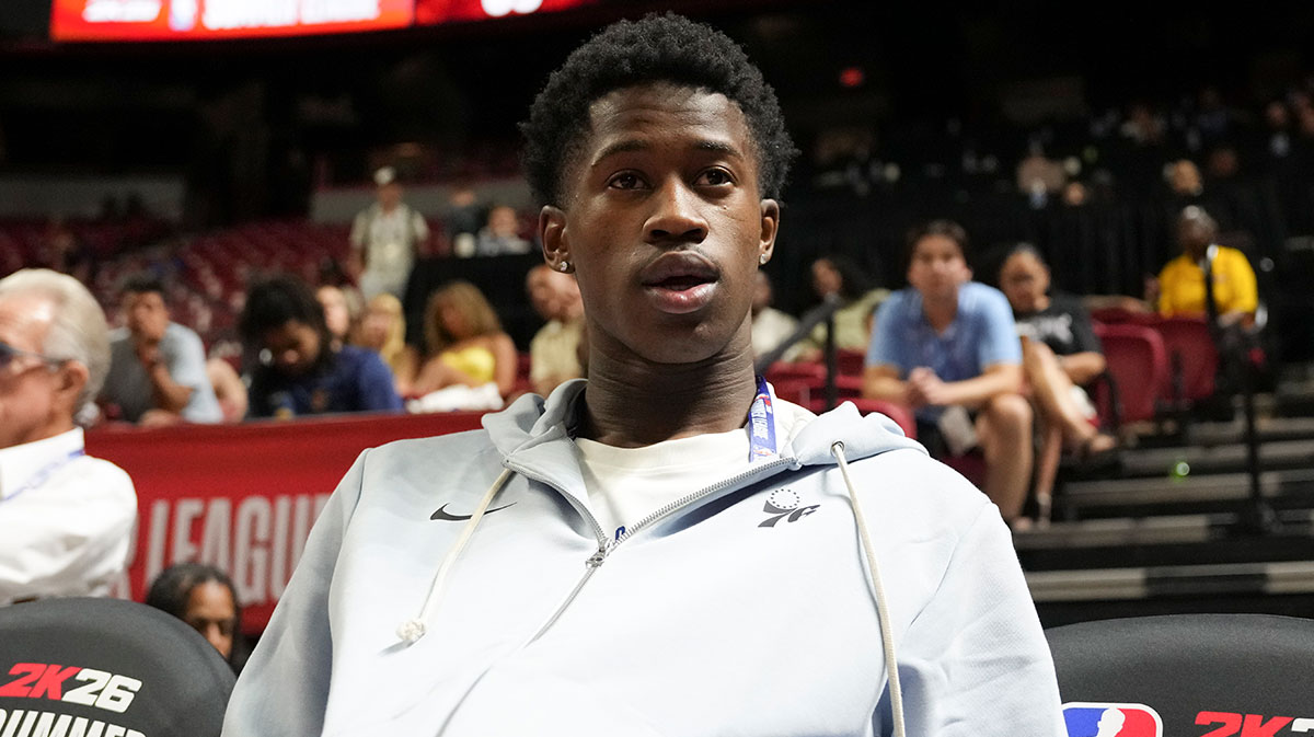 76ers guard VJ Edgecombe (77) watches the game against the San Antonio Spurs from the baseline at Thomas & Mack Center with the Baylor logo in the background
