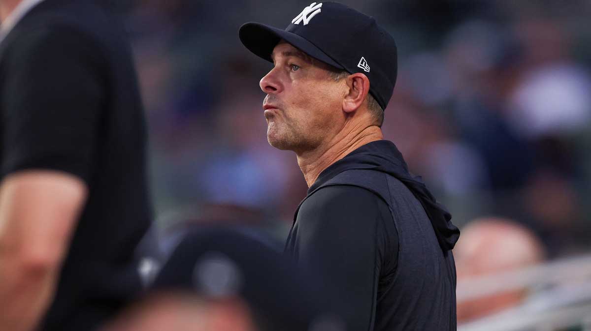 New York Yankees manager Aaron Boone (17) in the dugout against the Atlanta Braves in the fifth inning at Truist Park. 