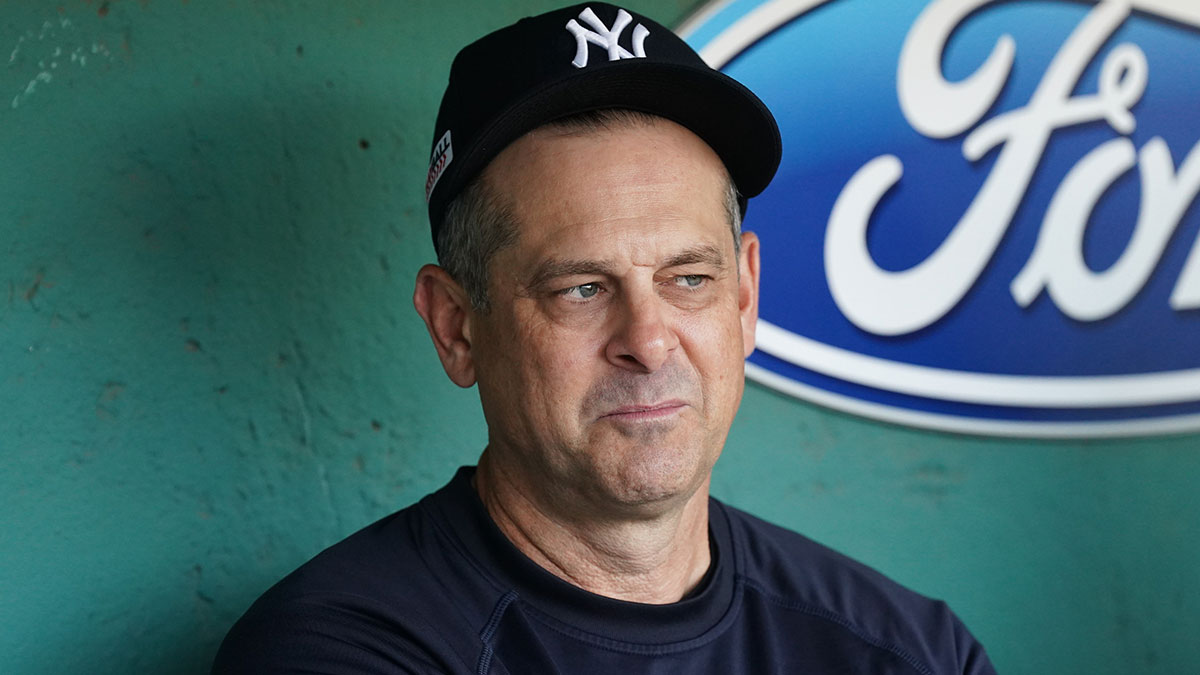 New York Yankees manager Aaron Boone (17) in the dugout before the start of the game against the Boston Red Sox at Fenway Park.