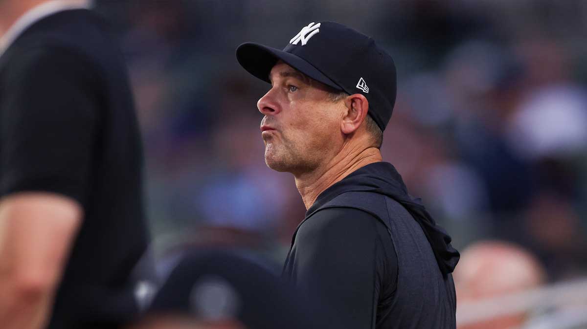 New York Yankees manager Aaron Boone (17) in the dugout against the Atlanta Braves in the fifth inning at Truist Park