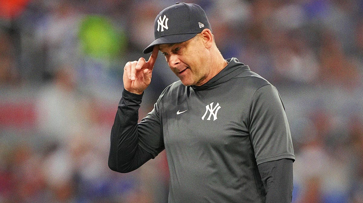 New York Yankees manager Aaron Boone walks to the dug out after making a pitching change against the Toronto Blue Jays during the fifth inning at Rogers Centre.