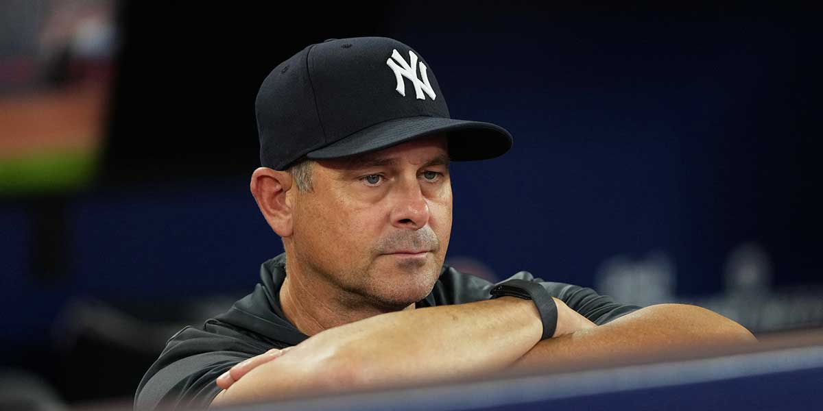 New York Yankees manager Aaron Boone (17) watches batting practice before a game against the Toronto Blue Jays at Rogers Centre.