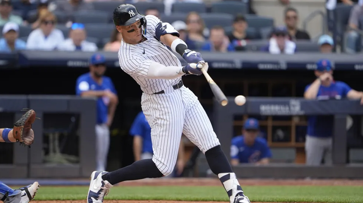New York Yankees right fielder Aaron Judge (99) hits a double during the fourth inning at Yankee Stadium.