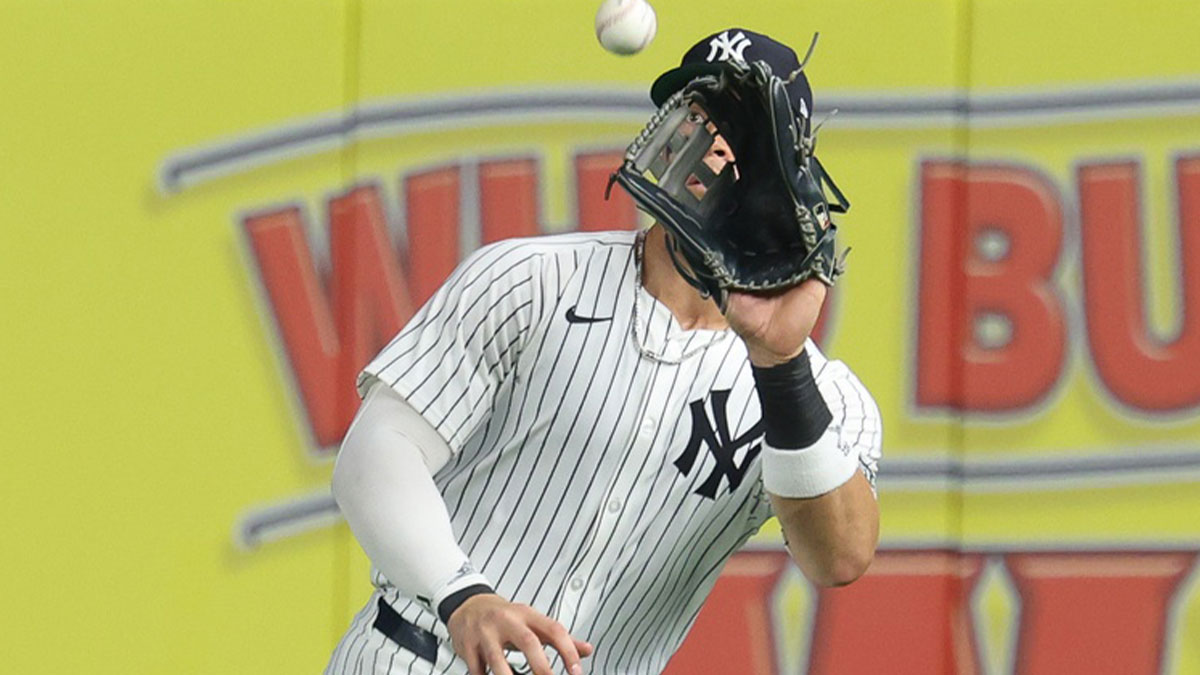 New York Yankees right fielder Aaron Judge (99) makes a catch for an out during the ninth inning against the Philadelphia Phillies at Yankee Stadium.