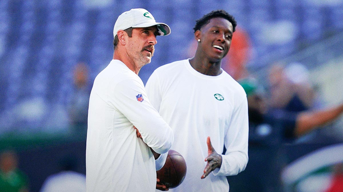 New York Jets quarterback Aaron Rodgers, left, and cornerback Sauce Gardner on the field before the Jets take on the Tampa Bay Buccaneers in a preseason NFL game at MetLife Stadium.