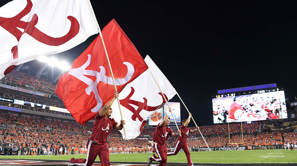 Alabama Crimson Tide cheerleaders run flags in the end zone after a touchdown during the first quarter against the Clemson Tigers in the 2017 College Football Playoff National Championship Game at Raymond James Stadium.