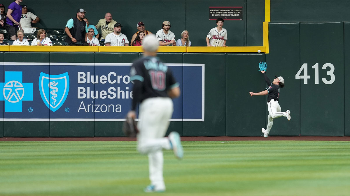 Arizona Diamondbacks outfielder Alek Thomas (5) makes a catch against the Colorado Rockies in the third inning at Chase Field.