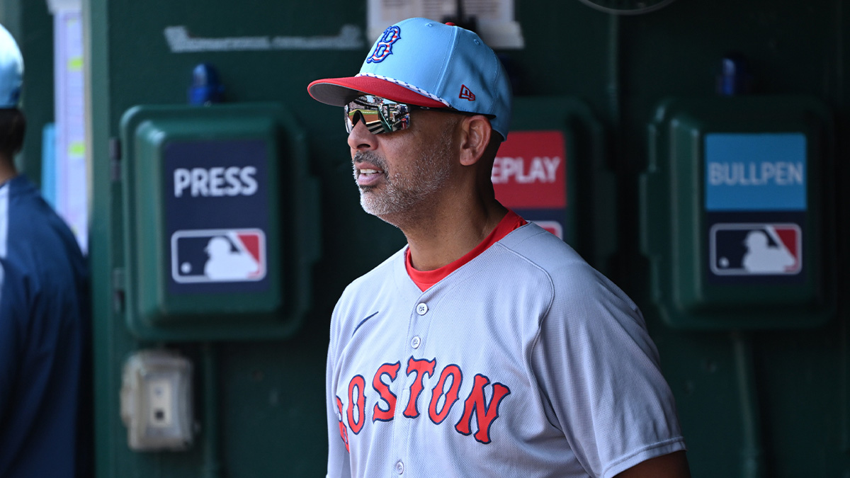 Boston Red Sox manager Alex Cora (13) stands in the dugout during the eighth inning of a game against the Washington Nationals at Nationals Park.