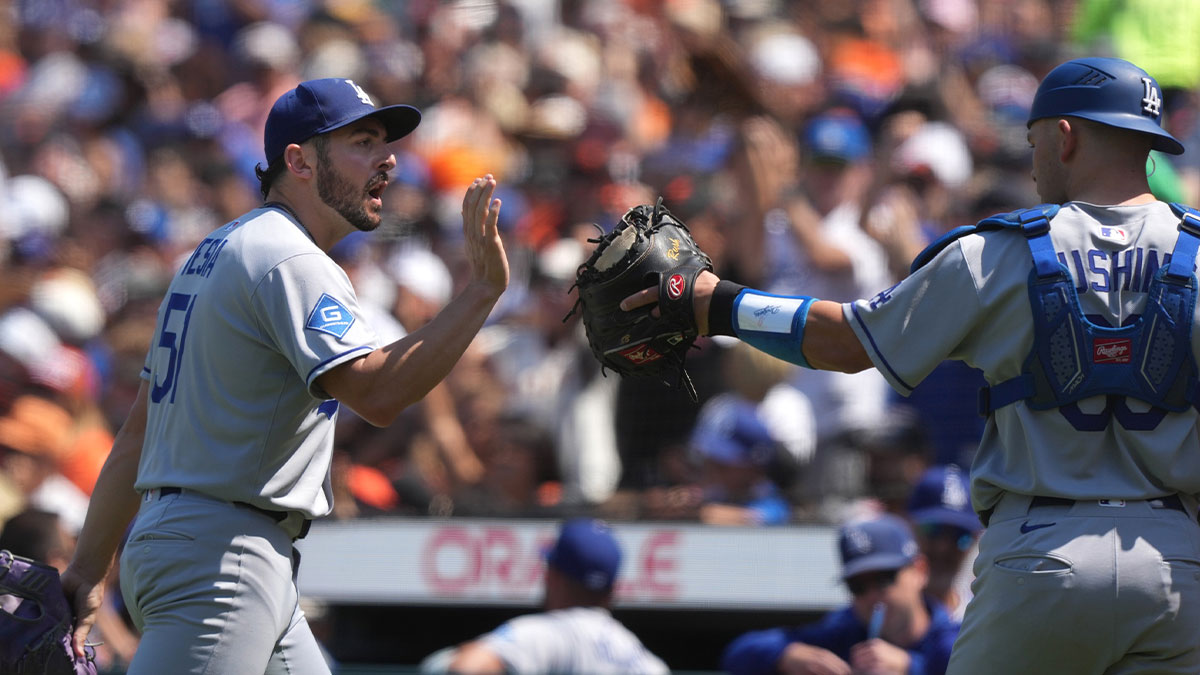 Los Angeles Dodgers pitcher Alex Vesia (left) celebrates with catcher Dalton Rushing (right) after the final out of the eighth inning against the San Francisco Giants at Oracle Park.