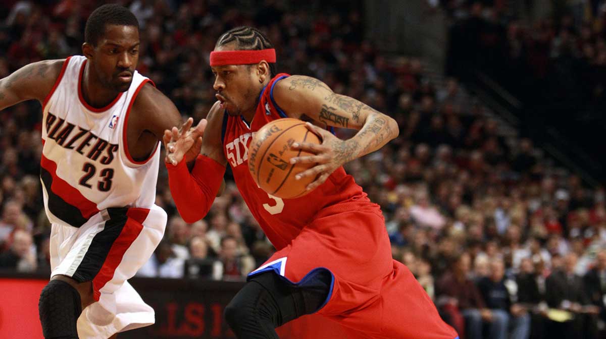 Philadelphia 76ers guard Allen Iverson (3) drives past Portland Trailblazers forward Martell Webster (23) at the Rose Garden.