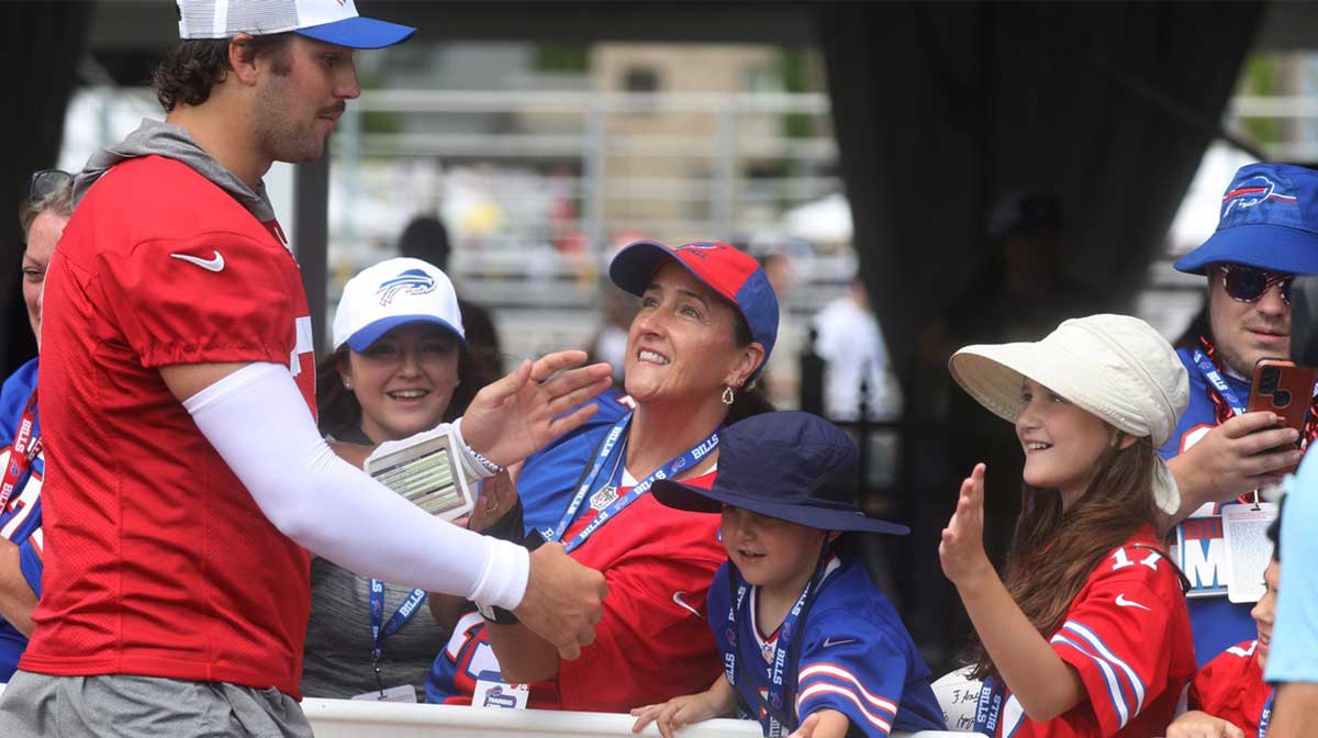 Bills Quarterback Josh Allen gives high-fives to fans as he circles the stadium at the end of Bills training camp at St. John Fisher University in Pittsford, NY on August 8, 2024. Today was the last day at St. John Fisher.