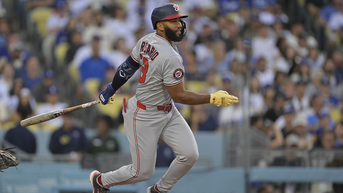 Washington Nationals third base Amed Rosario (13) singles during the third inning against the Los Angeles Dodgers at Dodger Stadium.