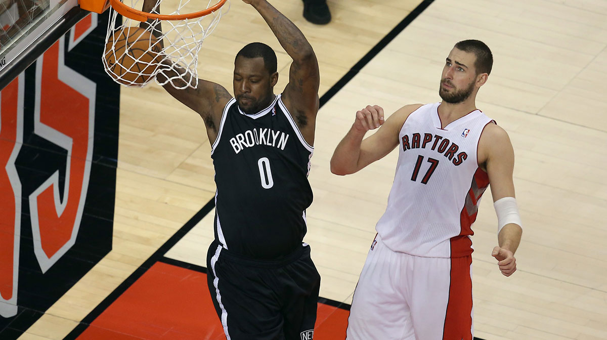 Brooklyn Nets forward Andray Blatche (0) dunks against Toronto Raptors center Jonas Valanciunas (17) in game seven of the first round of the 2014 NBA Playoffs at Air Canada Centre.