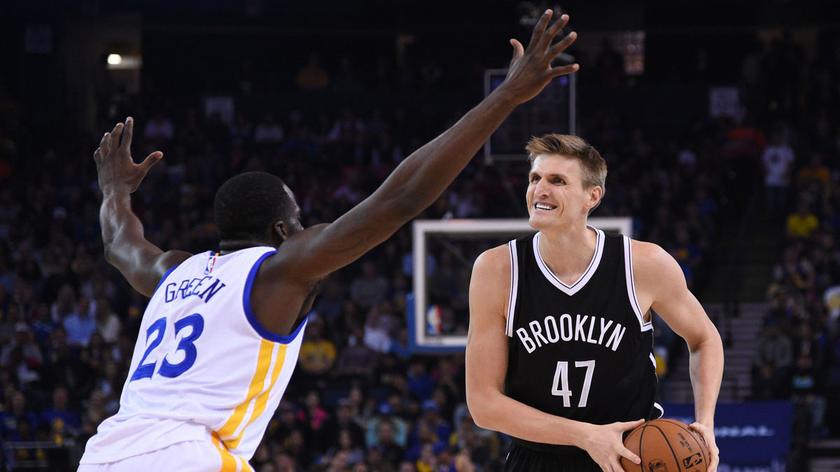Brooklyn Nets forward Andrei Kirilenko (47) controls the basketball against Golden State Warriors forward Draymond Green (23) during the first quarter at Oracle Arena.