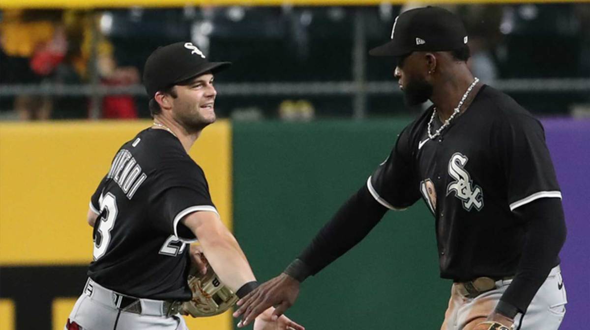Chicago White Sox left fielder Andrew Benintendi (23) and center fielder Luis Robert Jr. (88) celebrate after defeating the Pittsburgh Pirates at PNC Park.