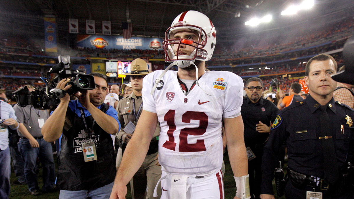 Stanford's Andrew Luck (12) walks of the field after losing the Fiesta Bowl between the Oklahoma State University Cowboys (OSU) and the Stanford Cardinal at the University of Phoenix Stadium