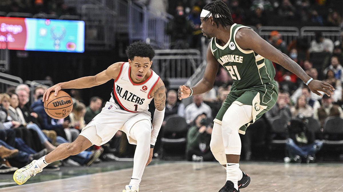 Portland Trail Blazers guard Anfernee Simons (1) drives for the basket against Milwaukee Bucks guard Jrue Holiday (21) in the fourth quarter at Fiserv Forum.