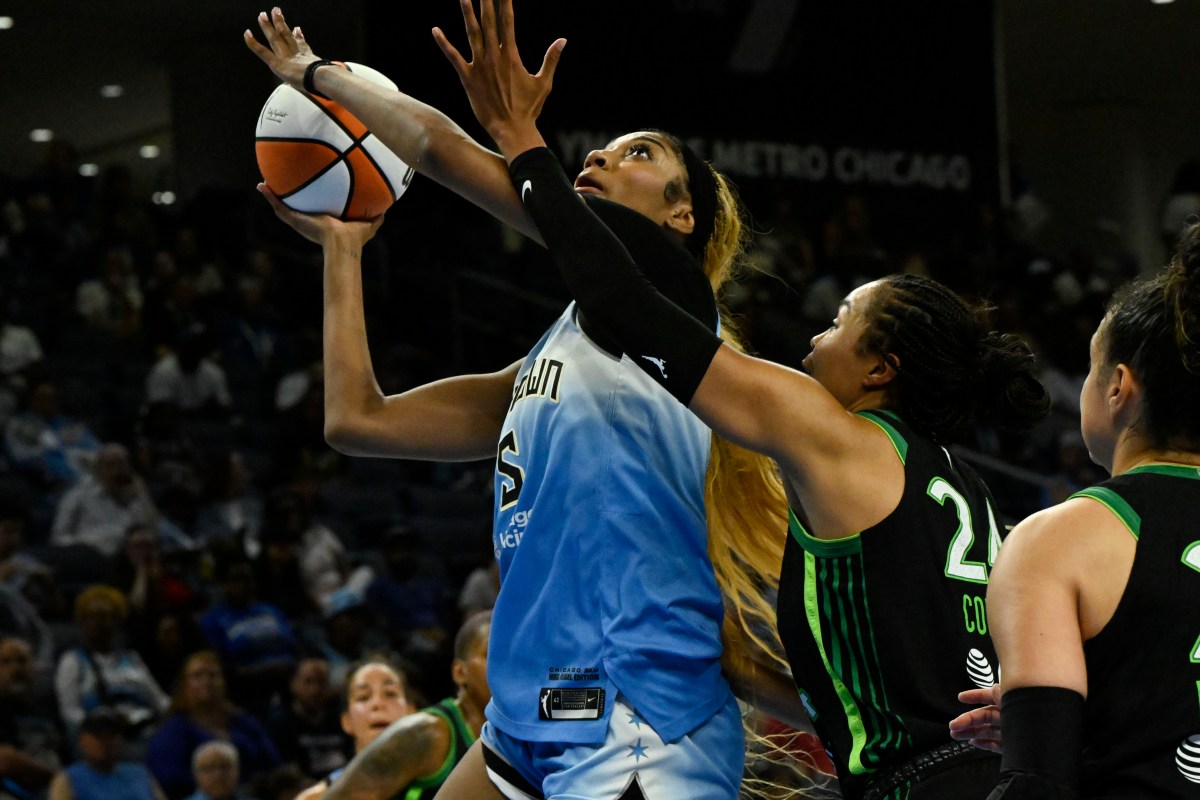 Chicago Sky forward Angel Reese (5) shoots against Minnesota Lynx forward Napheesa Collier (24) during the second half at Wintrust Arena.