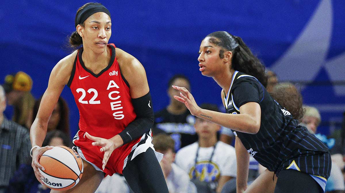Las Vegas Aces center A'ja Wilson (22) is defended by Chicago Sky forward Angel Reese (5) during the first half at Wintrust Arena.