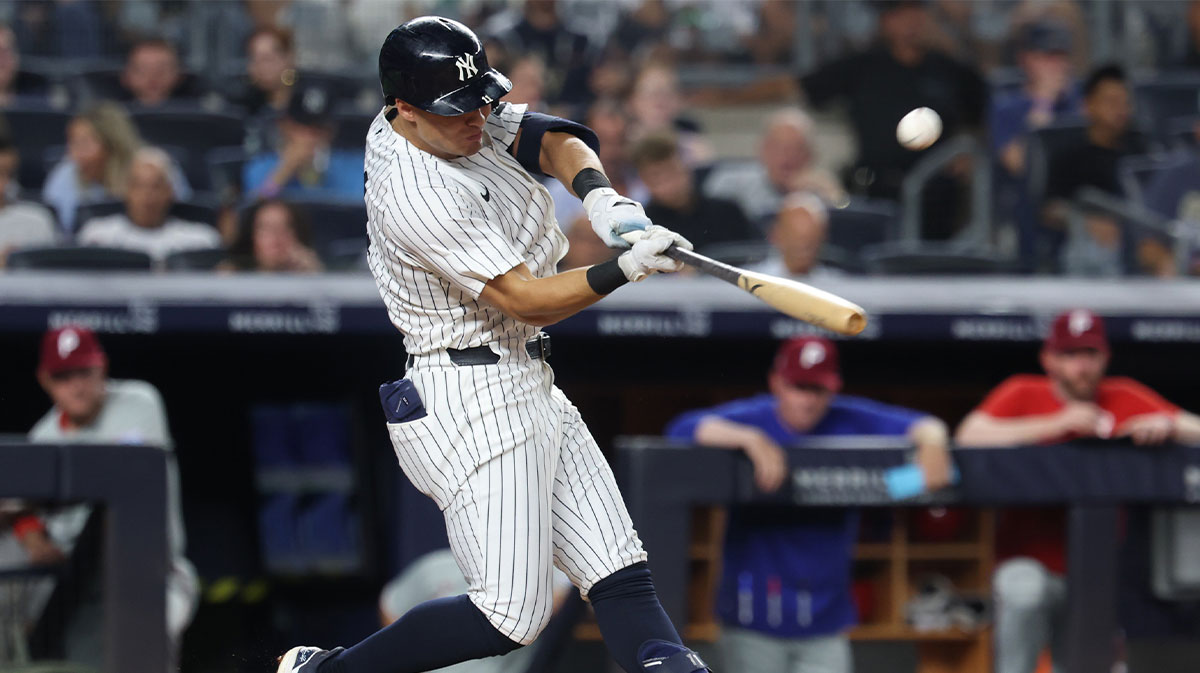 New York Yankees shortstop Anthony Volpe (11) hits a solo home run during the seventh inning against the Philadelphia Phillies at Yankee Stadium.