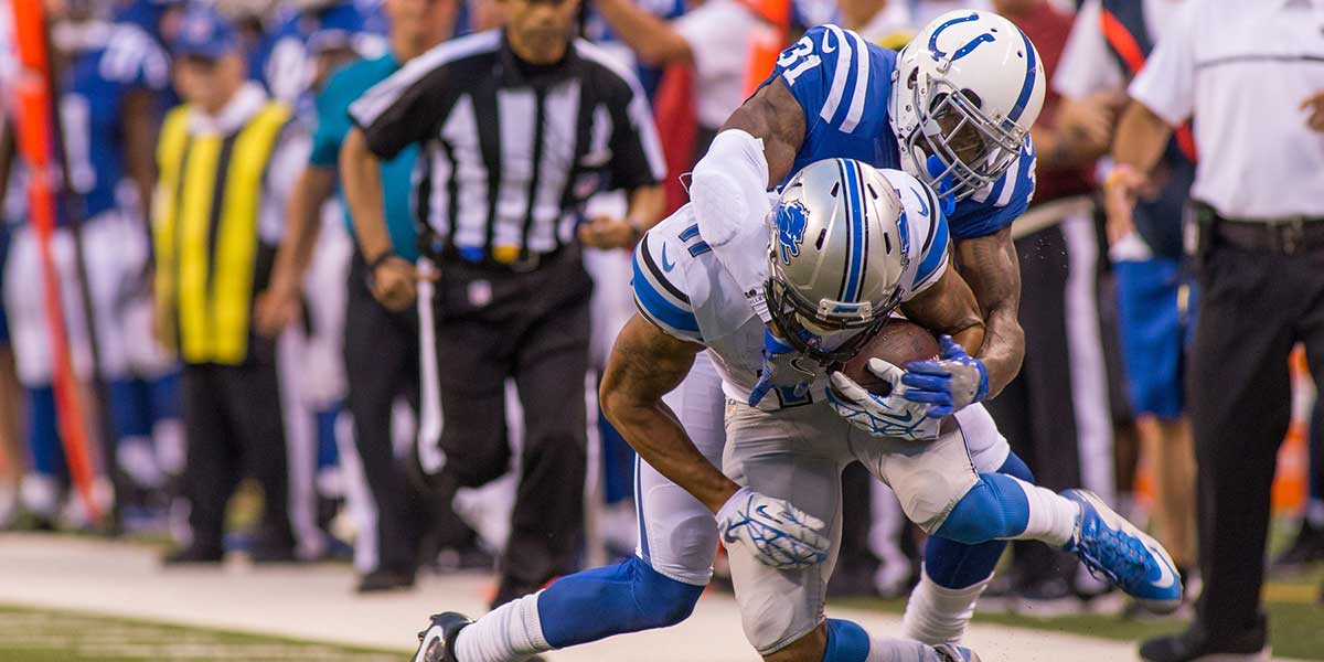 Detroit Lions wide receiver Marvin Jones (11) is tackled by Indianapolis Colts defensive back Antonio Cromartie (31) in the second half of the game at Lucas Oil Stadium. the Detroit Lions beat the Indianapolis Colts by the score of 39-35.