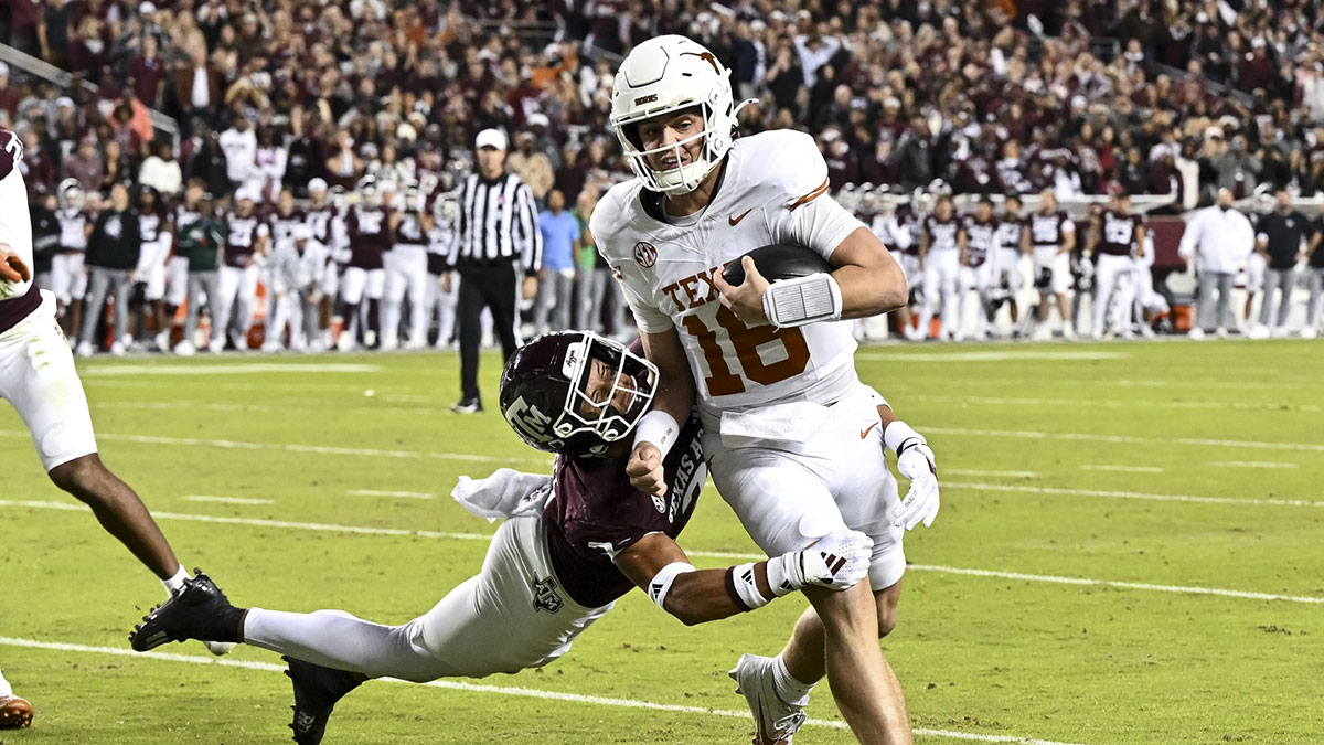 Texas Longhorns quarterback Arch Manning (16) breaks the attempted tackle from Texas A&M Aggies defensive back Marcus Ratcliffe (3) during the first half. The Longhorns defeated the Aggies 17-7 at Kyle Field.