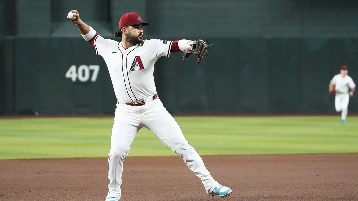 Arizona Diamondbacks third baseman Eugenio Suarez fields the ball and throws out Houston Astros' Yainer Diaz in the first inning at Chase Field in Phoenix on July 23, 2025.