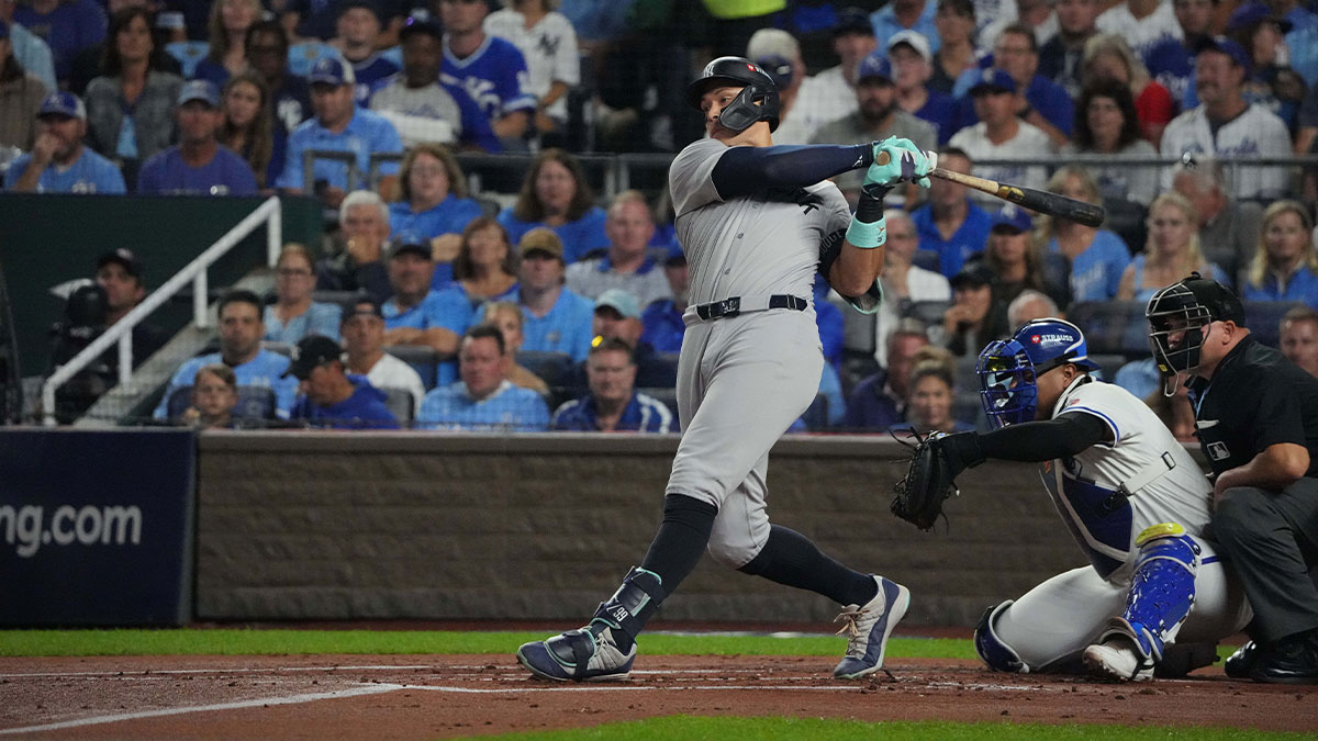 New York Yankees outfielder Aaron Judge (99) hits a single during the first inning against the Kansas City Royals during game four of the ALDS for the 2024 MLB Playoffs at Kauffman Stadium.