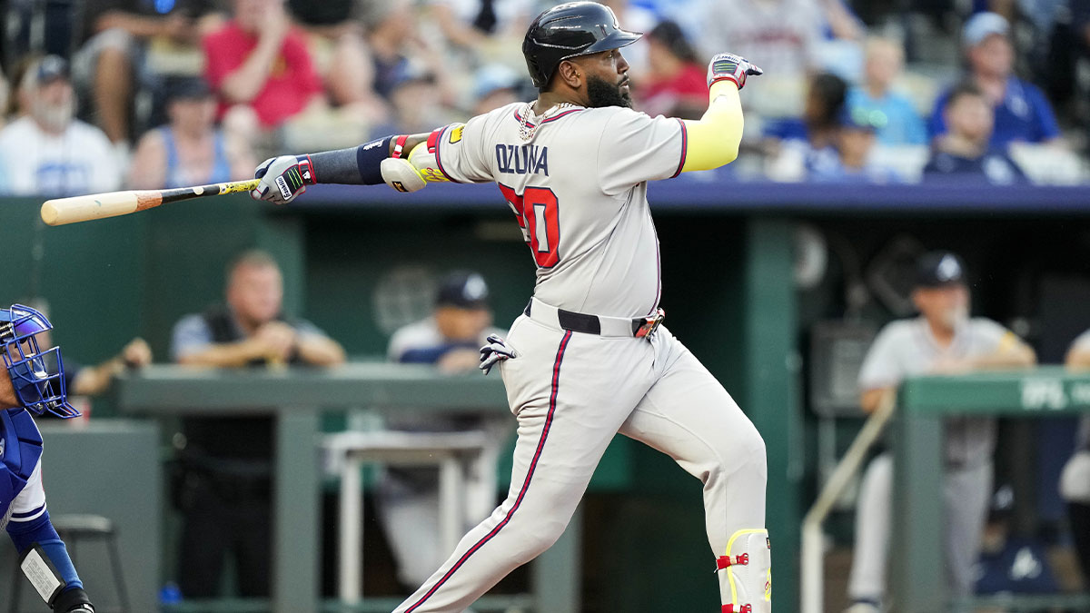 Atlanta Braves designated hitter Marcell Ozuna (20) hits a home run during the sixth inning against the Kansas City Royals at Kauffman Stadium.