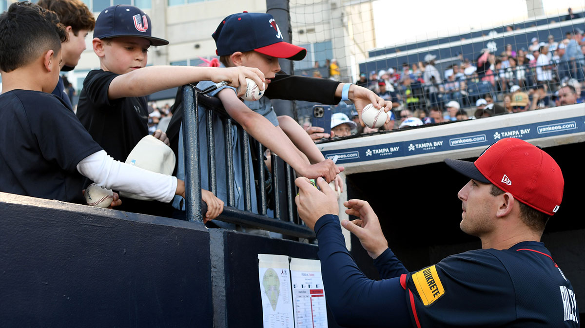 Atlanta Braves third baseman Austin Riley (27) signs autographs before the start of the game against the New York Yankees during spring training at George M. Steinbrenner Field.