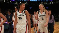 UConn women's basketball guards Azzi Fudd and Paige Bueckers celebrate after the game against the Louisville Cardinals at Barclays Center.