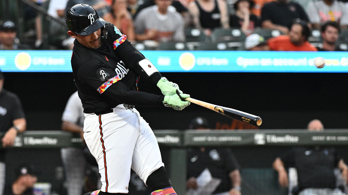 Baltimore Orioles catcher Alex Jackson (70) hits a solo home run during the second inning against the Colorado Rockies at Oriole Park at Camden Yards.