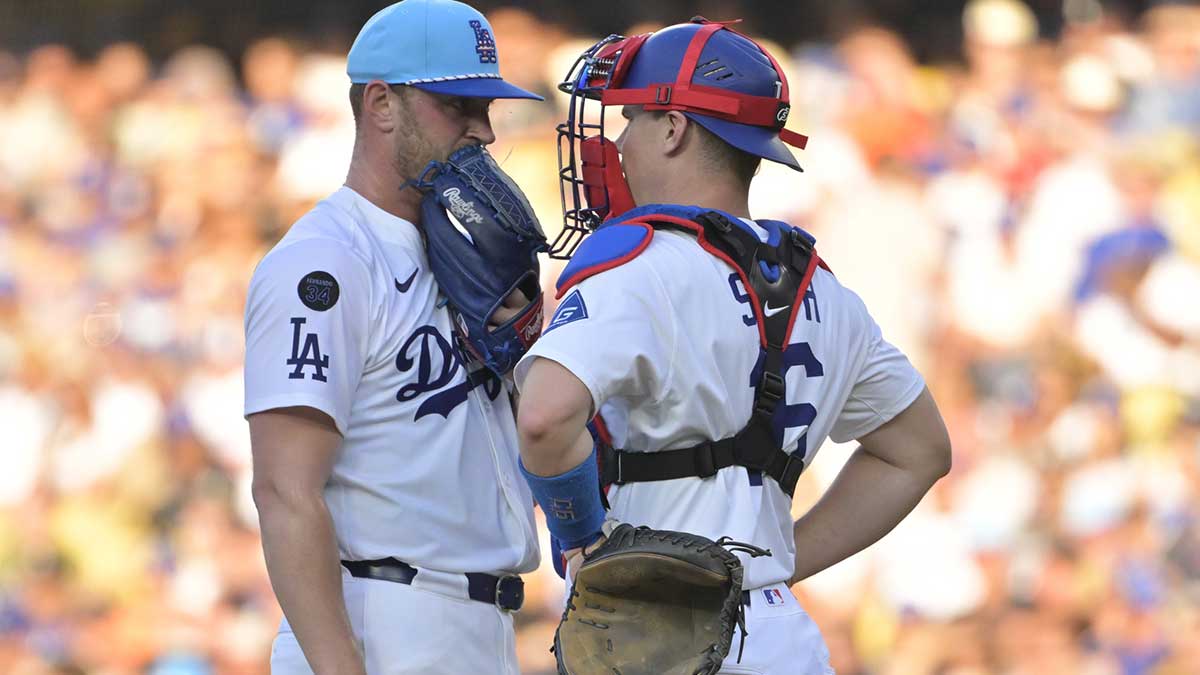 Los Angeles Dodgers catcher Will Smith (16) talks with pitcher Ben Casparius (78) during the third inning against the Houston Astros at Dodger Stadium.
