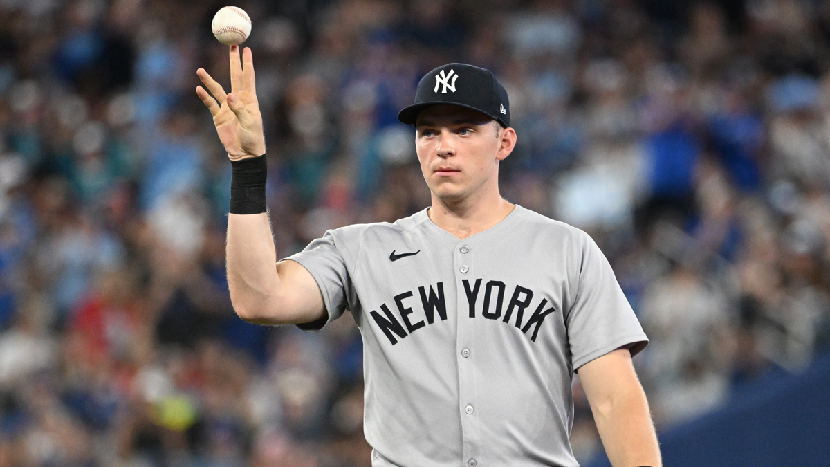 New York Yankees first baseman Ben Rice (22) flips the ball away after committing a fielding error that led to a Toronto Blue Jays run in the sixth inning at Rogers Centre