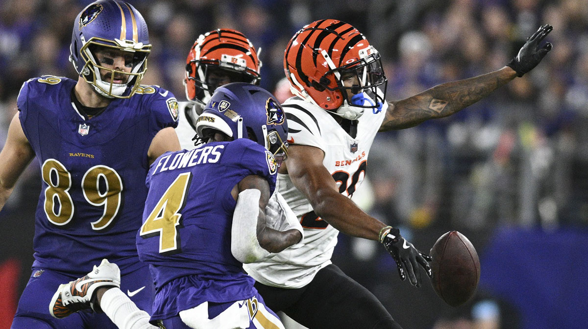 Cincinnati Bengals cornerback Dax Hill (23) breaks up a pass intended for Baltimore Ravens wide receiver Zay Flowers (4) during the first half at M&T Bank Stadium. 