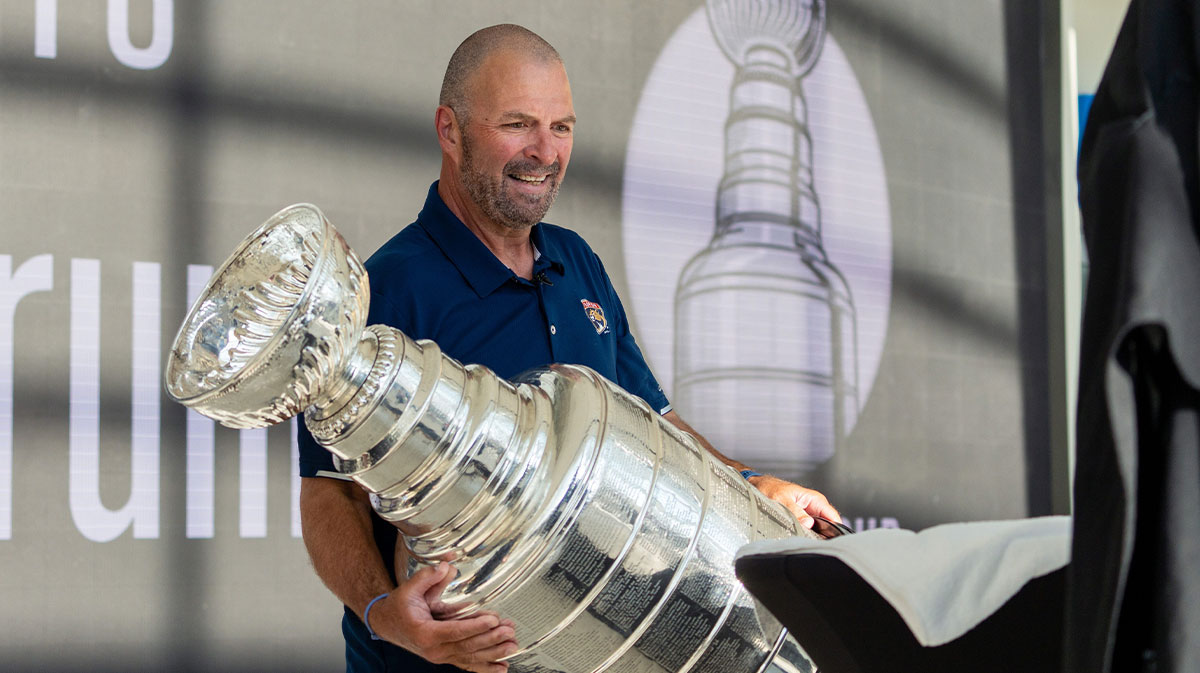 Panthers General Manager Bill Zito places the Stanley Cup on a table on Wednesday August 14, 2024 at Fiserv Forum in Milwaukee, Wis.