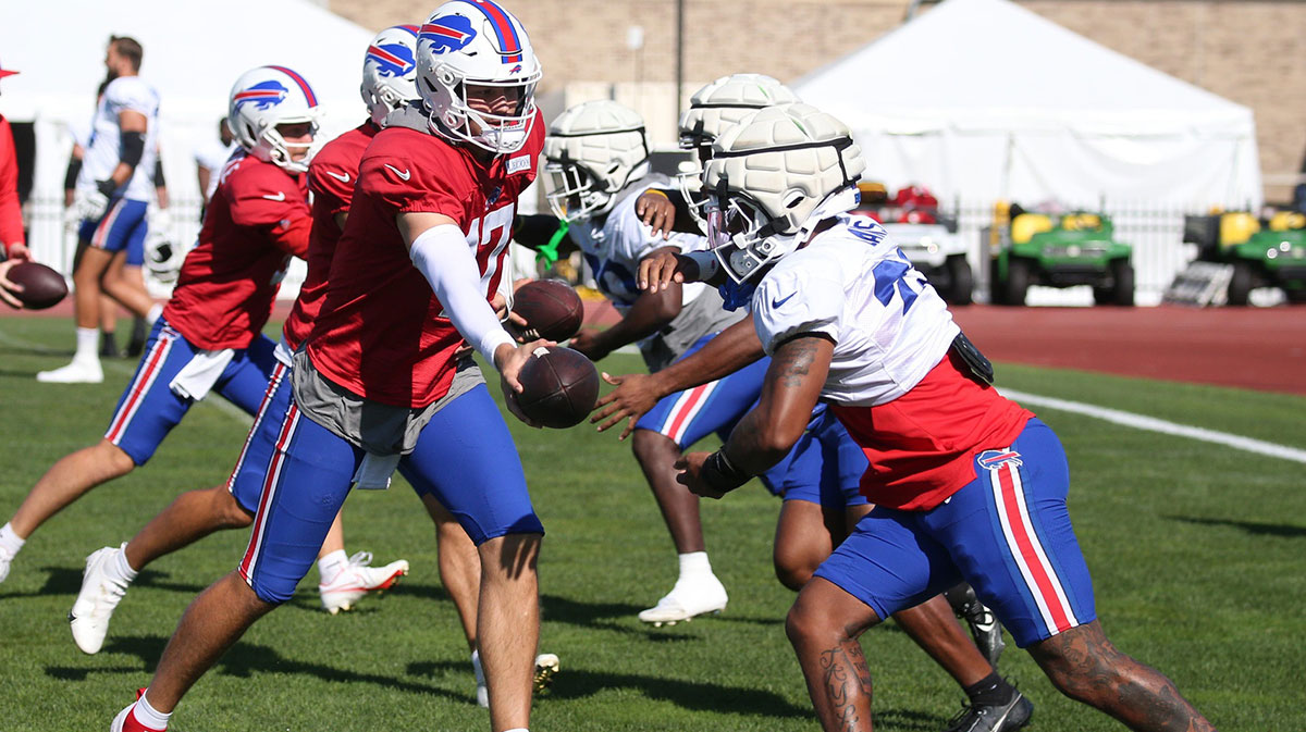 Bills quarterback Josh Allen hands off to running back Ray Davis during drills during the Buffalo Bills training camp Wednesday, Aug. 7, 2024 at St. John Fisher University.