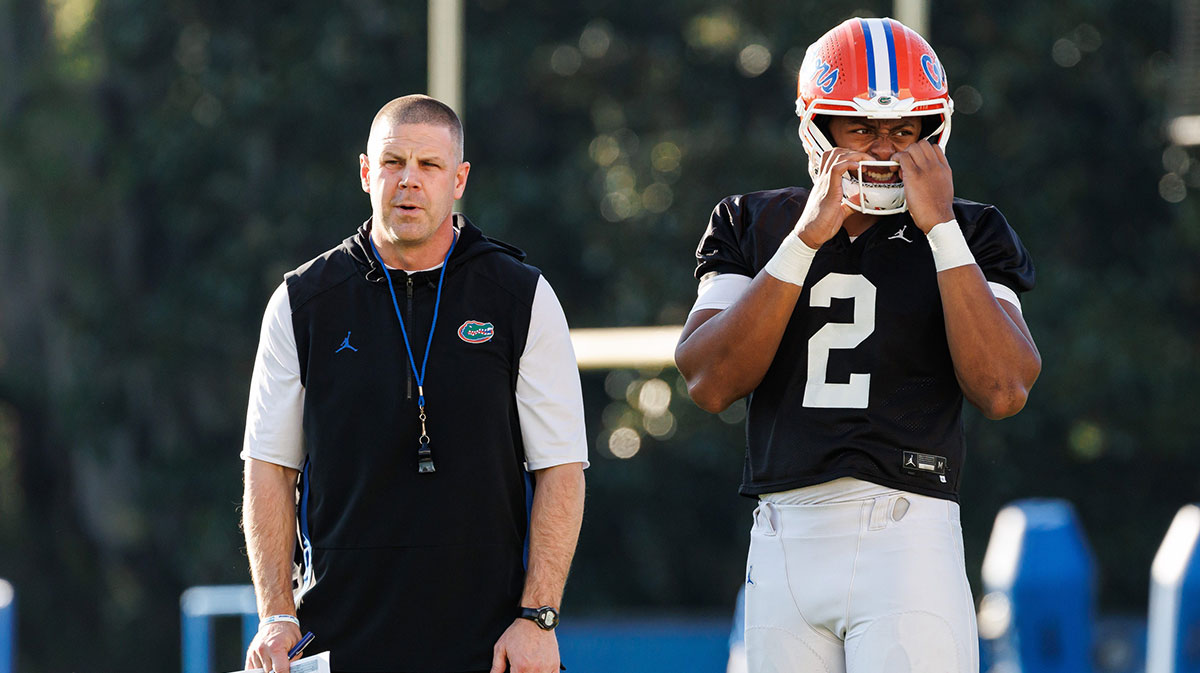 Florida Gators head coach Billy Napier and Florida Gators quarterback DJ Lagway (2) watch during spring football practice at Heavener Football Complex at the University of Florida in Gainesville, FL on Thursday, March 6, 2025.