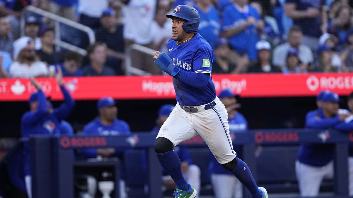 Jul 3, 2025; Toronto, Ontario, CAN; Toronto Blue Jays designated hitter George Springer (4) runs home to score on a double hit by right fielder Addison Barger (not pictured) against the New York Yankees during the first inning at Rogers Centre.