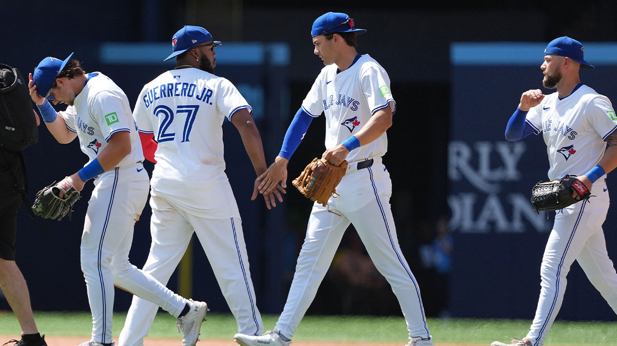 Toronto Blue Jays first baseman Vladimir Guerrero Jr. (27) celebrates the win with centre fielder Joey Loperfido (10) against the San Francisco Giants at the end of the ninth inning at Rogers Centre.