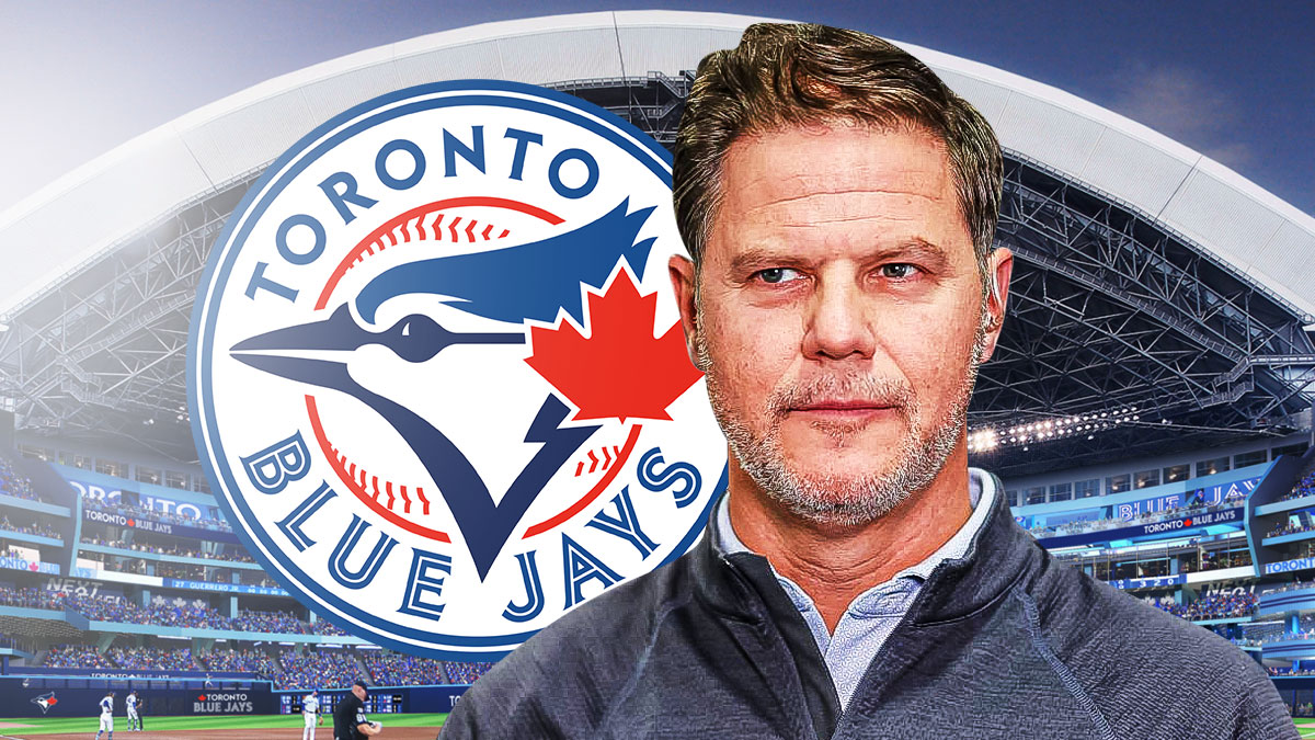 Blue Jays GM Ross Atkins, Rogers Centre in back