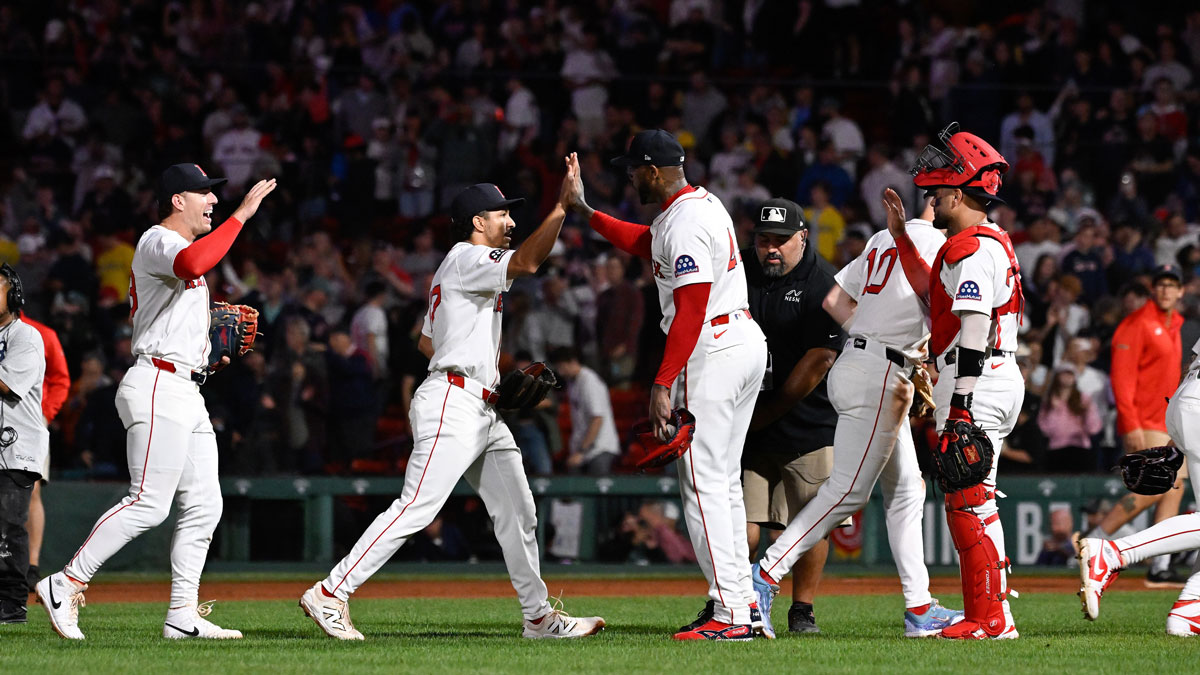 Jul 10, 2025; Boston, Massachusetts, USA; Boston Red Sox relief pitcher Aroldis Chapman (44) and catcher Carlos Narvaez (75) celebrate beating the Tampa Bay Rays with teammates at Fenway Park. Mandatory Credit: Eric Canha-Imagn Images