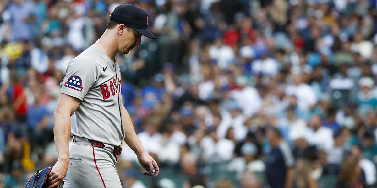 Boston Red Sox starting pitcher Walker Buehler (0) walks to the dugout after being relieved for during the fourth inning against the Seattle Mariners at T-Mobile Park.