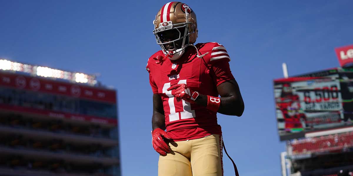 San Francisco 49ers wide receiver Brandon Aiyuk (11) walks on the field before the start of the game against the Kansas City Chiefs at Levi's Stadium. Mandatory Credit: Cary Edmondson-Imagn Images