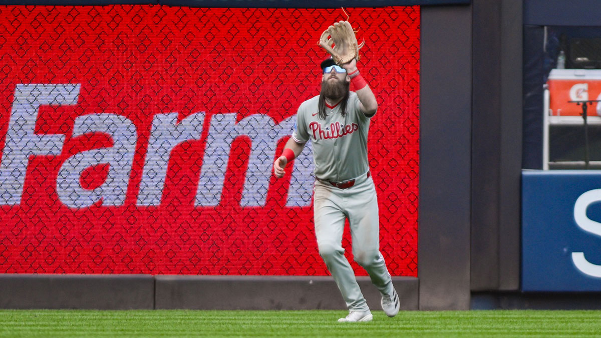 Philadelphia Phillies outfielder Brandon Marsh (16) catches a fly ball hit by New York Yankees shortstop Anthony Volpe (not pictured) during the eighth inning at Yankee Stadium