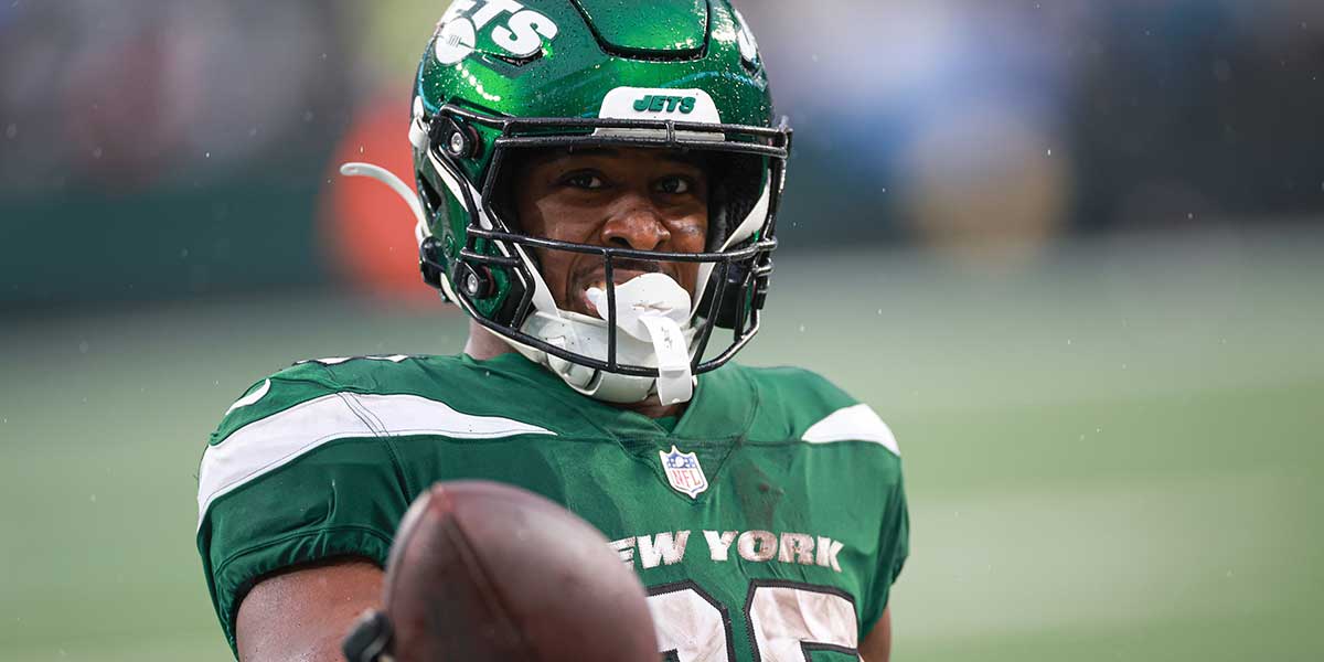 Dec 10, 2023; East Rutherford, New Jersey, USA; New York Jets running back Breece Hall (20) celebrates after a touchdown reception during the second half against the Houston Texans at MetLife Stadium. Mandatory Credit: Vincent Carchietta-Imagn Images