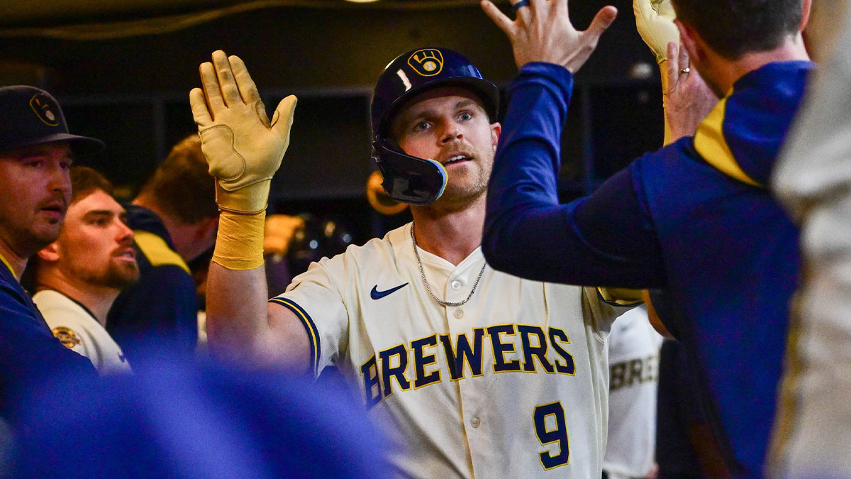 Milwaukee Brewers designated hitter Jake Bauers (9) is greeted after hitting a solo home run in the sixth inning against the Atlanta Braves at American Family Field.